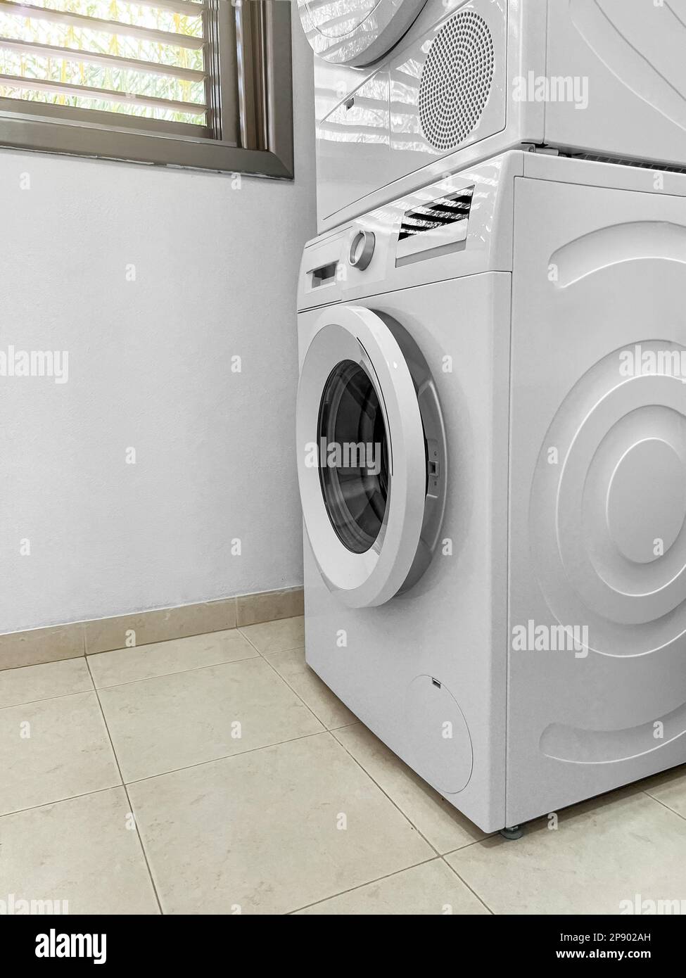 Modern washing machines in laundry room Stock Photo Alamy