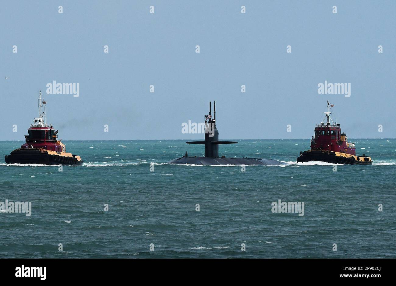 Port Canaveral, United States. 08th Mar, 2023. Tugboats guide a nuclear-powered U.S. Navy submarine into the Navy Port at Port Canaveral. According to U.S. officials, Australia is expected to purchase as many as five Virginia class nuclear-powered submarines from the United States to be delivered in the 2030ís pursuant to an agreement between the United States, Australia, and Great Britain. Credit: SOPA Images Limited/Alamy Live News Stock Photo