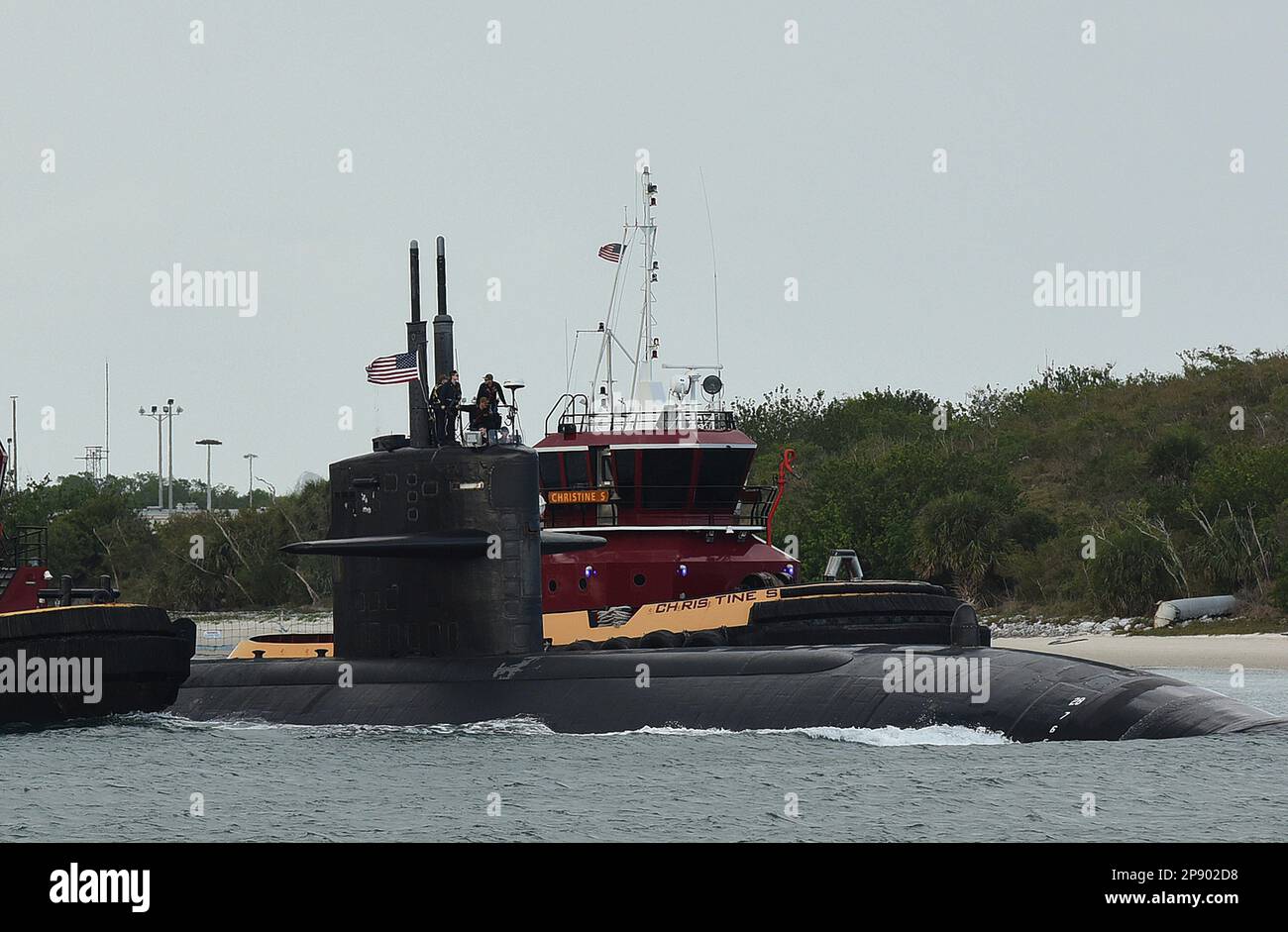 Port Canaveral, United States. 08th Mar, 2023. A tug guides a nuclear-powered U.S. Navy submarine into the Navy Port at Port Canaveral. According to U.S. officials, Australia is expected to purchase as many as five Virginia class nuclear-powered submarines from the United States to be delivered in the 2030ís pursuant to an agreement between the United States, Australia, and Great Britain. Credit: SOPA Images Limited/Alamy Live News Stock Photo