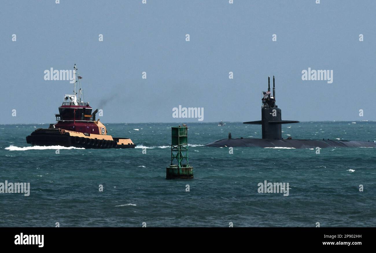 Port Canaveral, United States. 08th Mar, 2023. A tug guides a nuclear-powered U.S. Navy submarine into the Navy Port at Port Canaveral. According to U.S. officials, Australia is expected to purchase as many as five Virginia class nuclear-powered submarines from the United States to be delivered in the 2030ís pursuant to an agreement between the United States, Australia, and Great Britain. (Photo by Paul Hennessy/SOPA Images/Sipa USA) Credit: Sipa USA/Alamy Live News Stock Photo