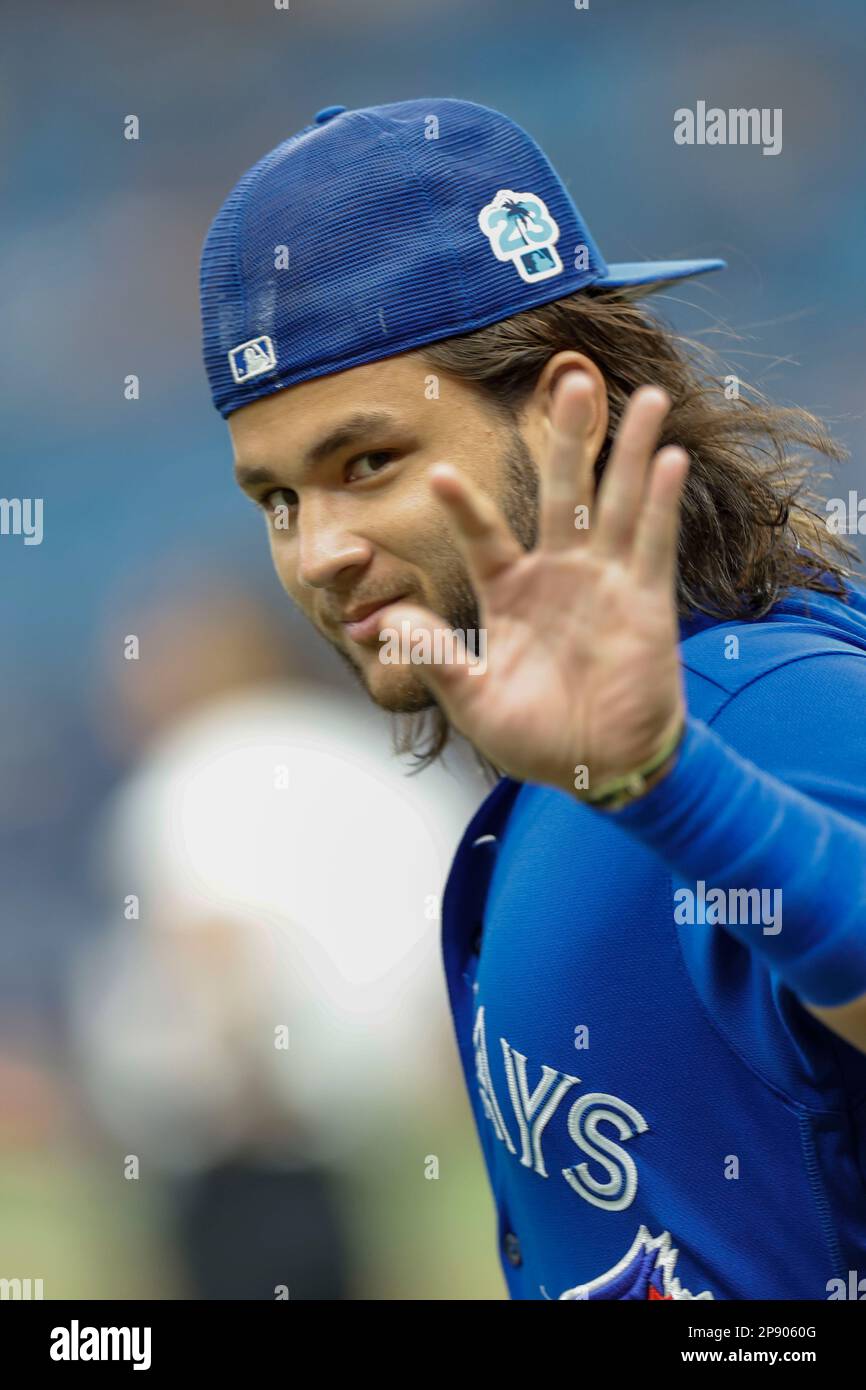 Tampa Bay Rays starting pitcher Shane Baz (11) waves during pregame warmups prior to an MLB spring training game against the Tampa Bay Rays at Tropica Stock Photo