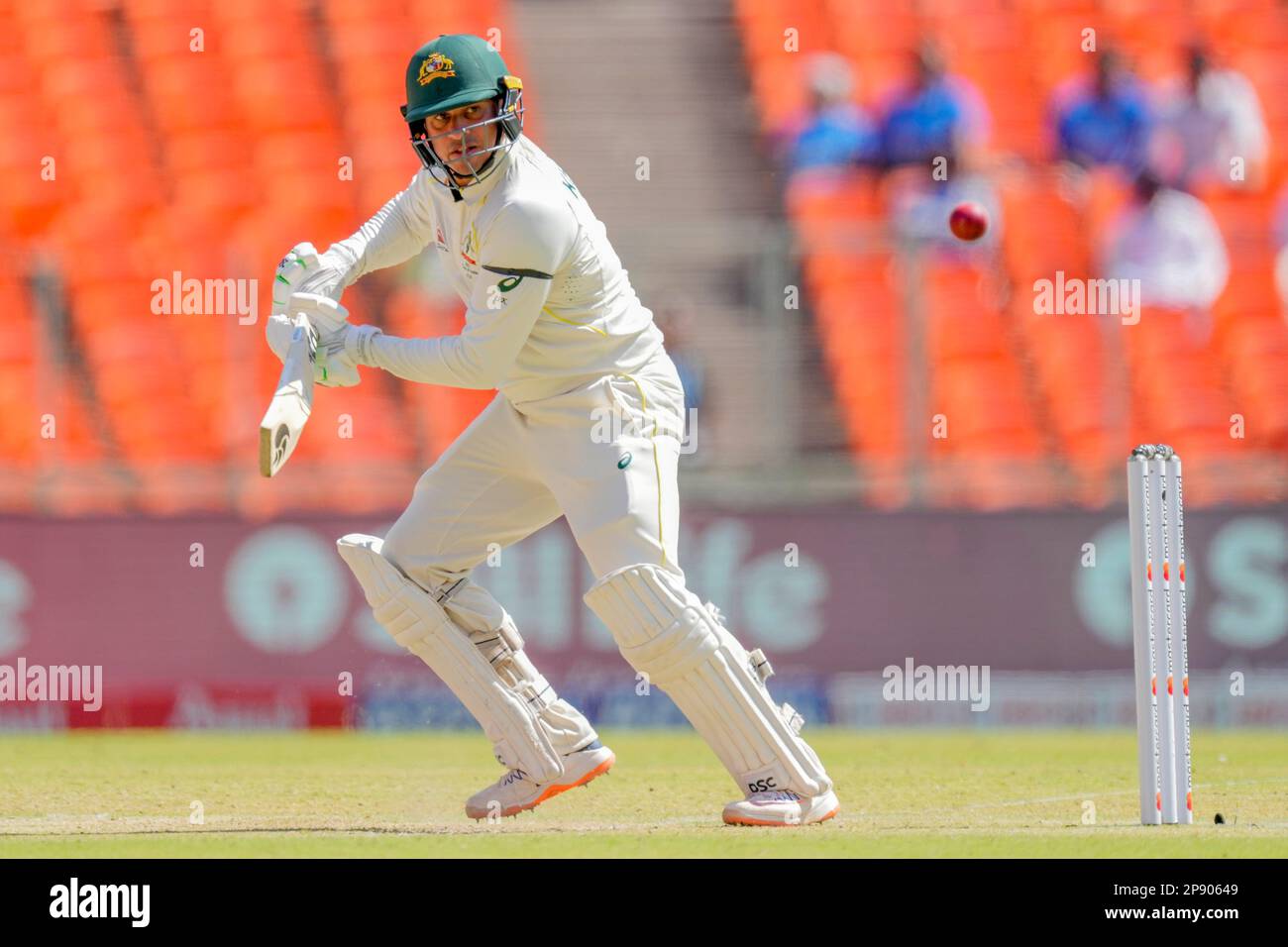 Australia's Usman Khawaja watches the ball after playing a shot during