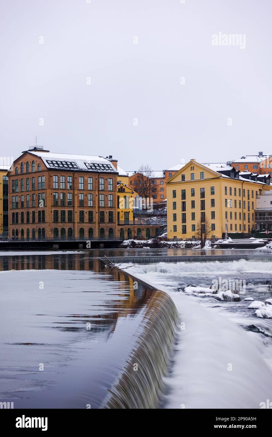 The river Motala Ström (Strömmen) by old industrial buildings, a landmark of Norrköping, Sweden Stock Photo