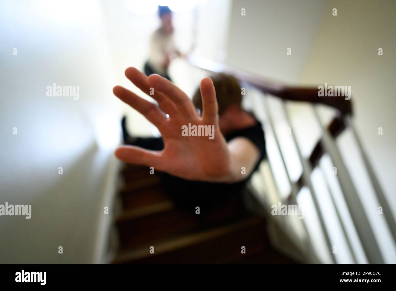 Hamburg, Germany. 12th Feb, 2023. A man sits in the stairwell and makes