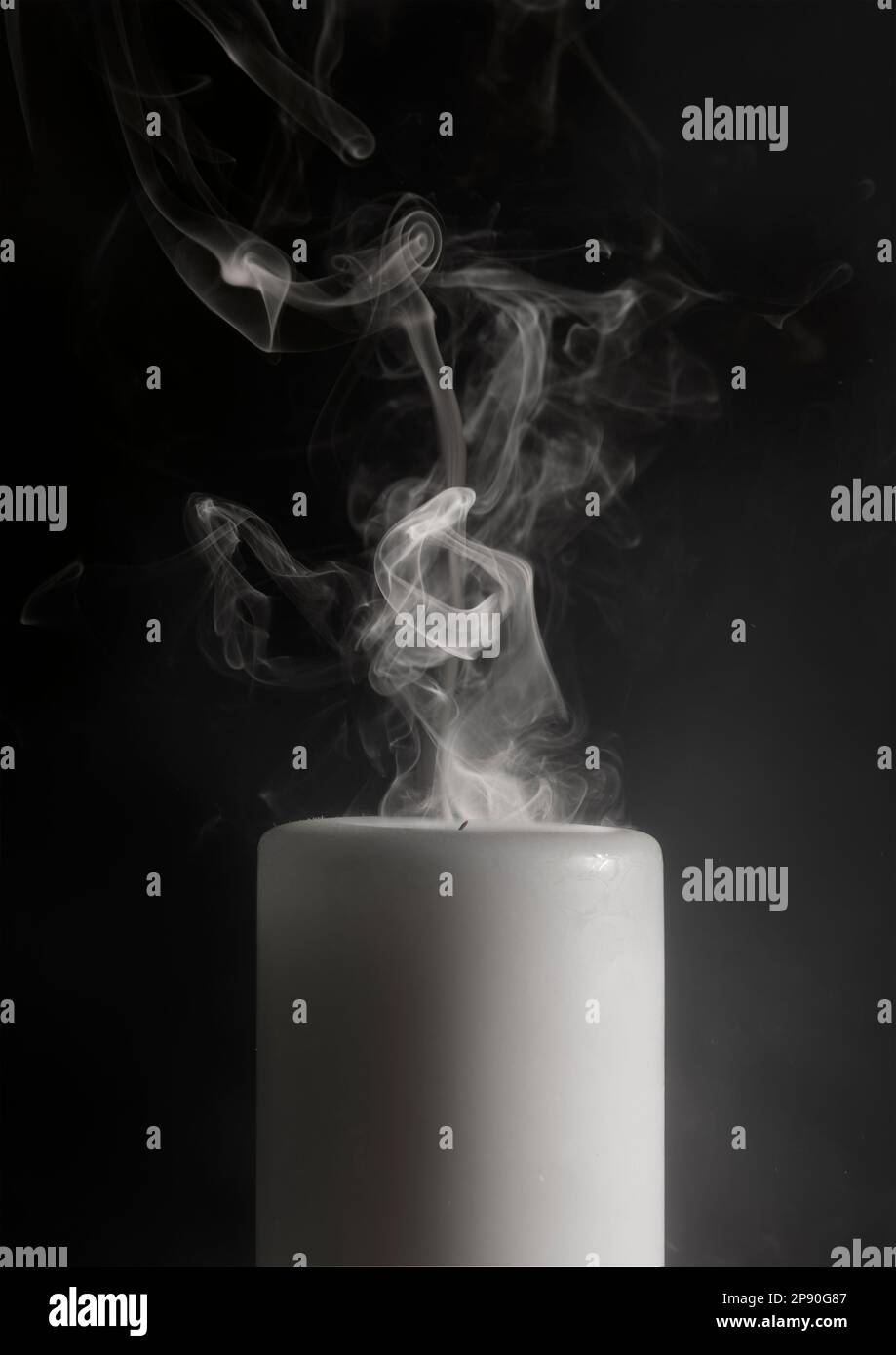 Candle just extinguished, with smoke Stock Photo Alamy