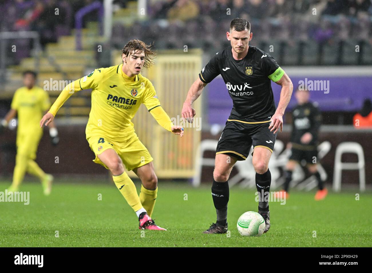 Brussel , Belgium . 09/03/2023, Jorge Pascual (43) of Villarreal and Jan Vertonghen (14) of Anderlecht pictured during a soccer game between RSC Anderlecht and Villarreal CF in the 1/8 th finals in the Uefa Europa Conference League for the 2022-2023 season , on  Thursday 9 March 2023  in Brussel , Belgium . PHOTO SPORTPIX | David Catry Stock Photo