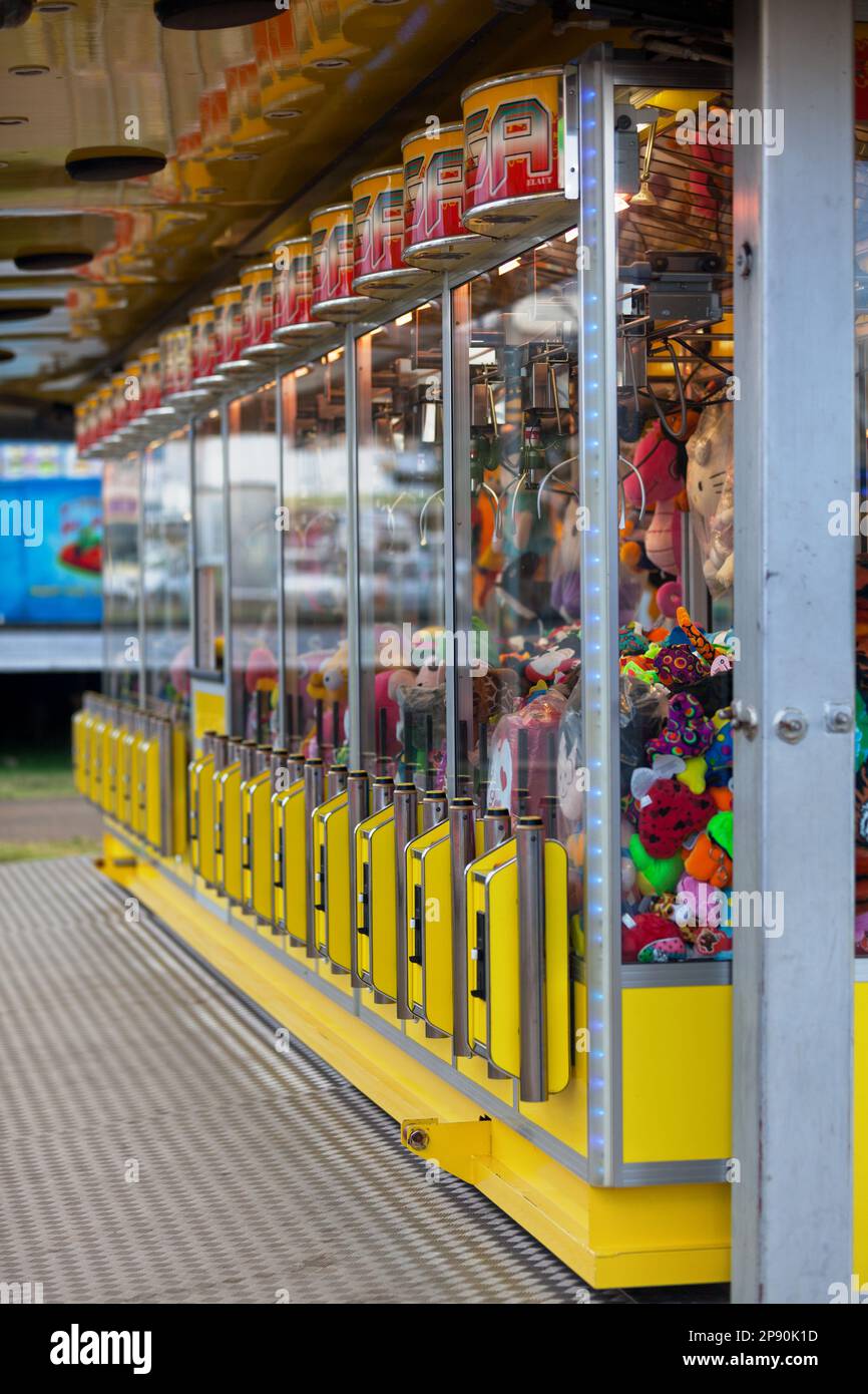 Saint Denis, Reunion - August 13 2016: Row of toy cranes arcade games in a carnival. Stock Photo