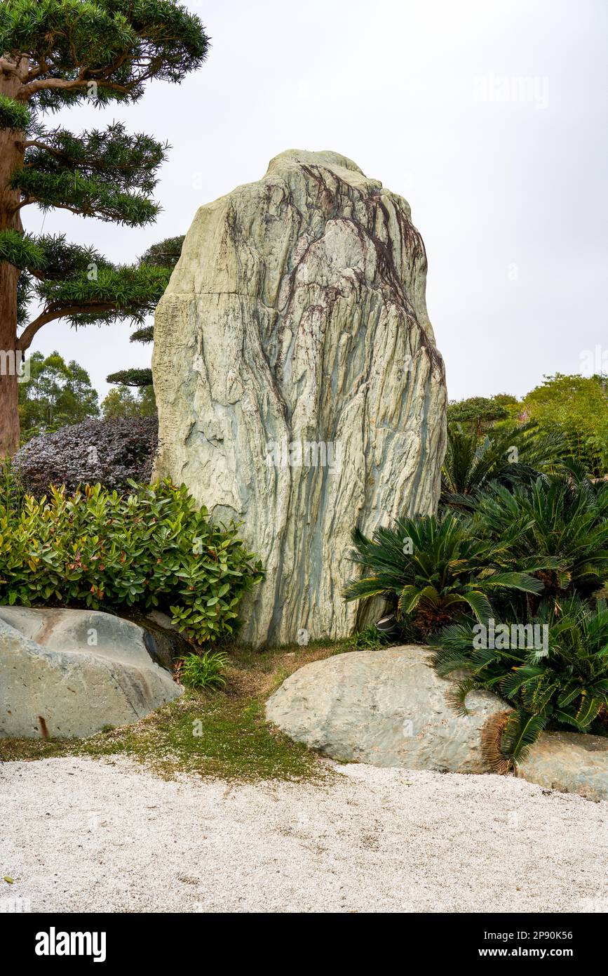 A huge rockery stone set in a japanese garden Stock Photo - Alamy