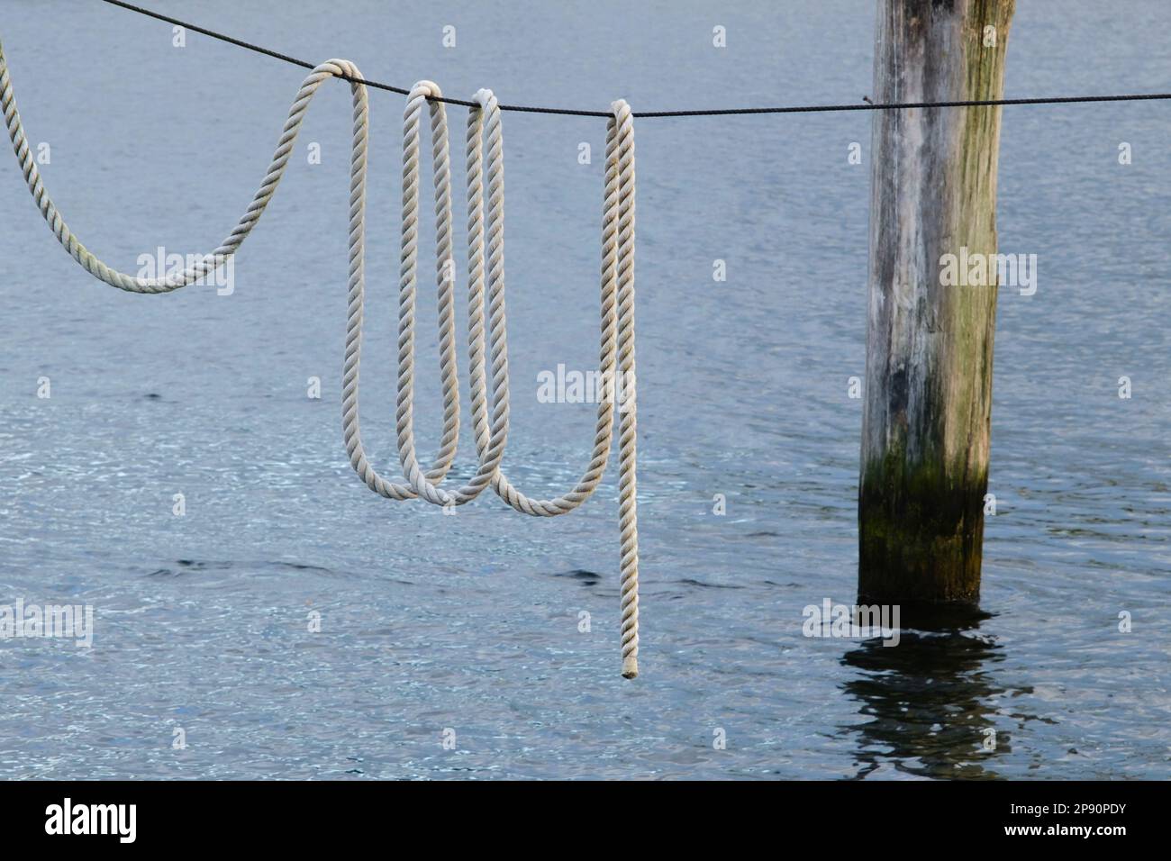Poller wit a rope at the Baltic Sea Stock Photo
