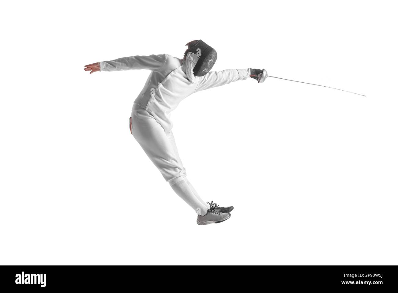 Professional male fencer in fencing costume training with sword