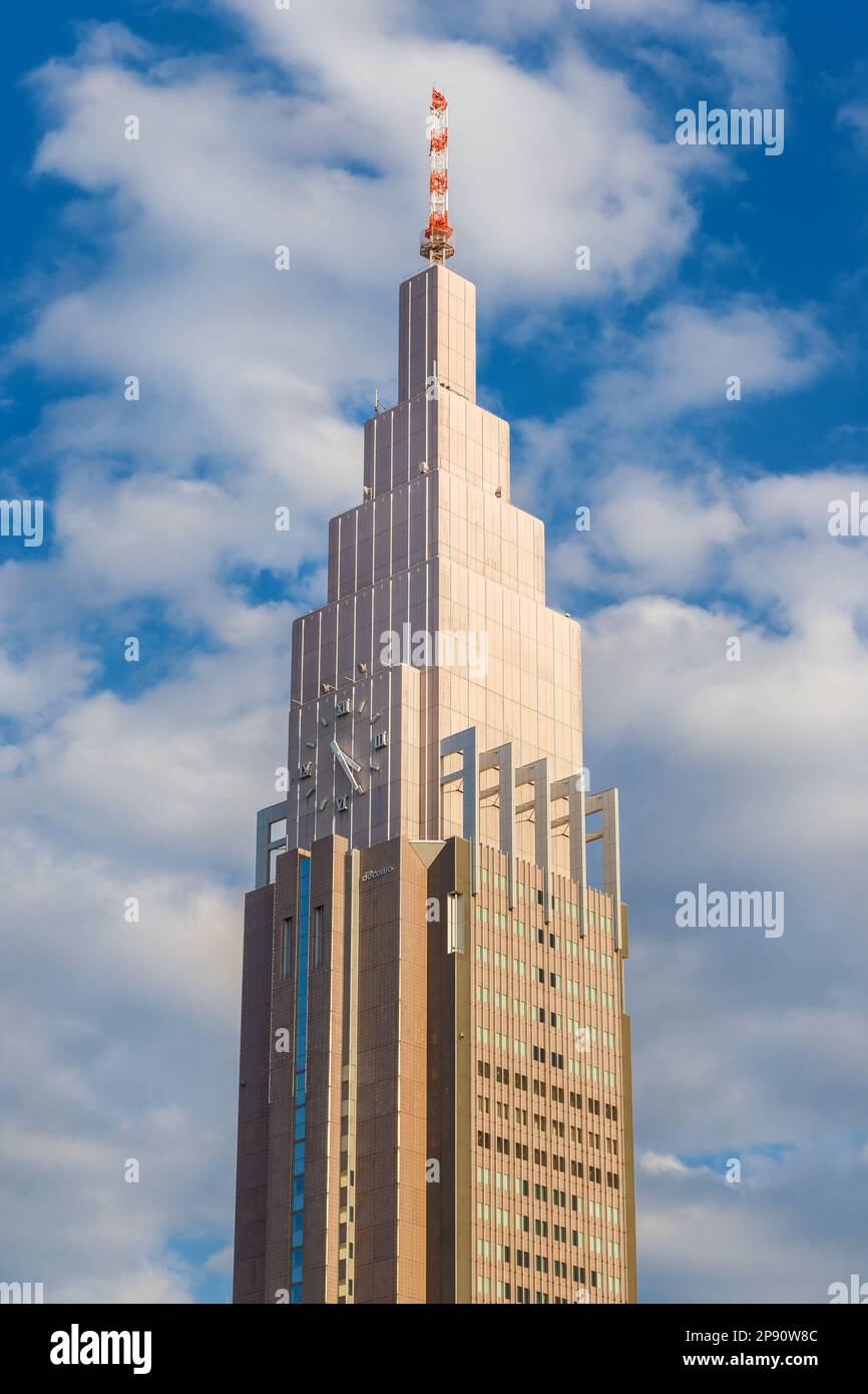 The iconic NTT Docomo Yoyogi Building in Tokyo, between Shibuya and Shinjuku Station. A city landamrk inspired by famous the Empire State Building in Stock Photo