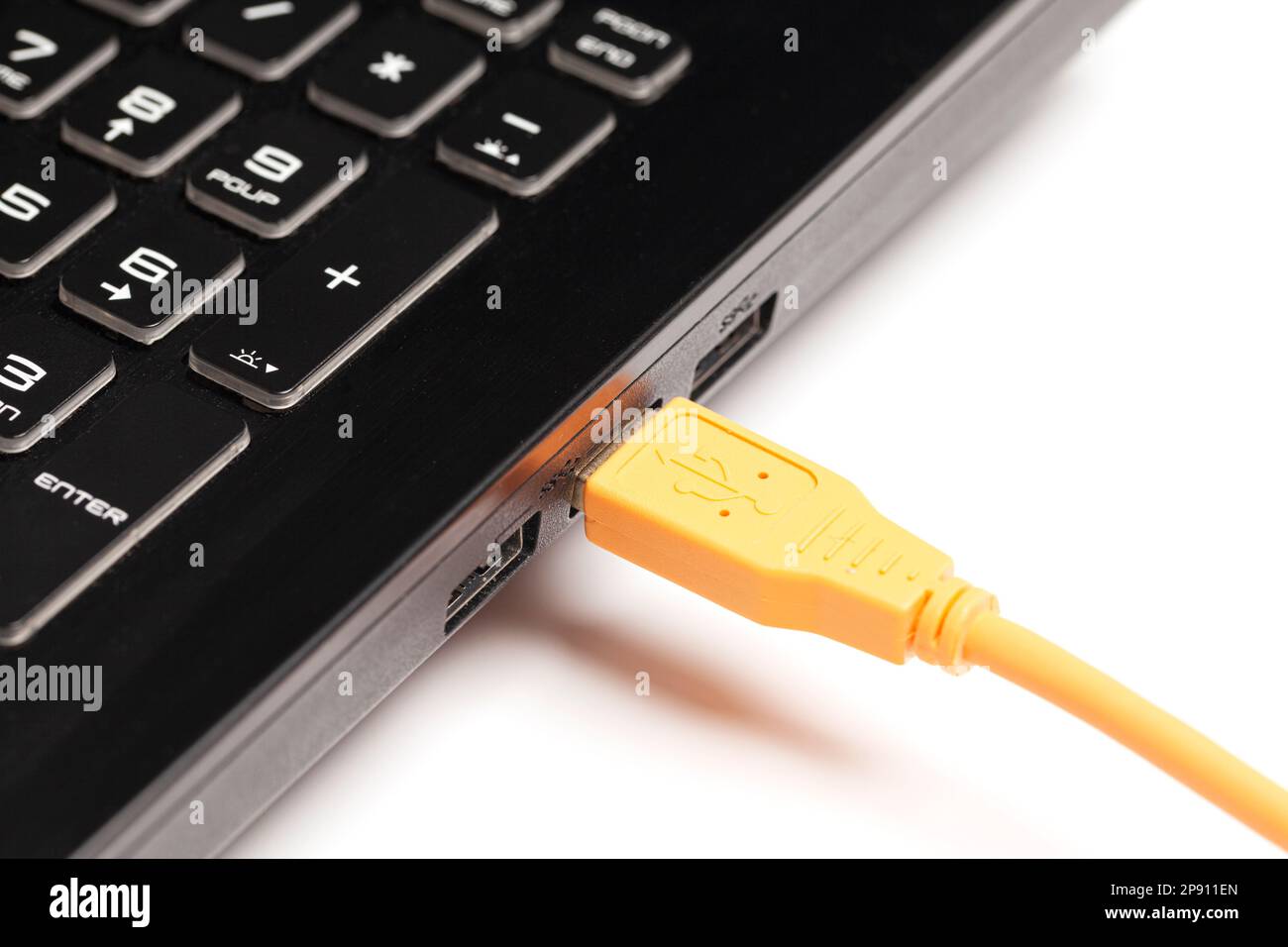 laptop with USB orange cable Stock Photo Alamy