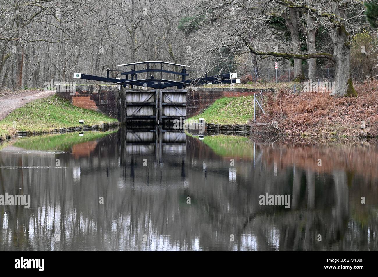 A canal lock on the beautiful Basingstoke Canal between Deepcut and Pirbright in Surrey Stock Photo