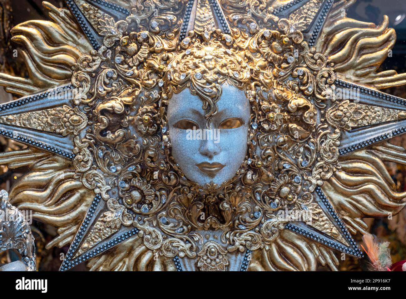 Face mask on display on a street venders stall, Venice, Italy. Stock Photo