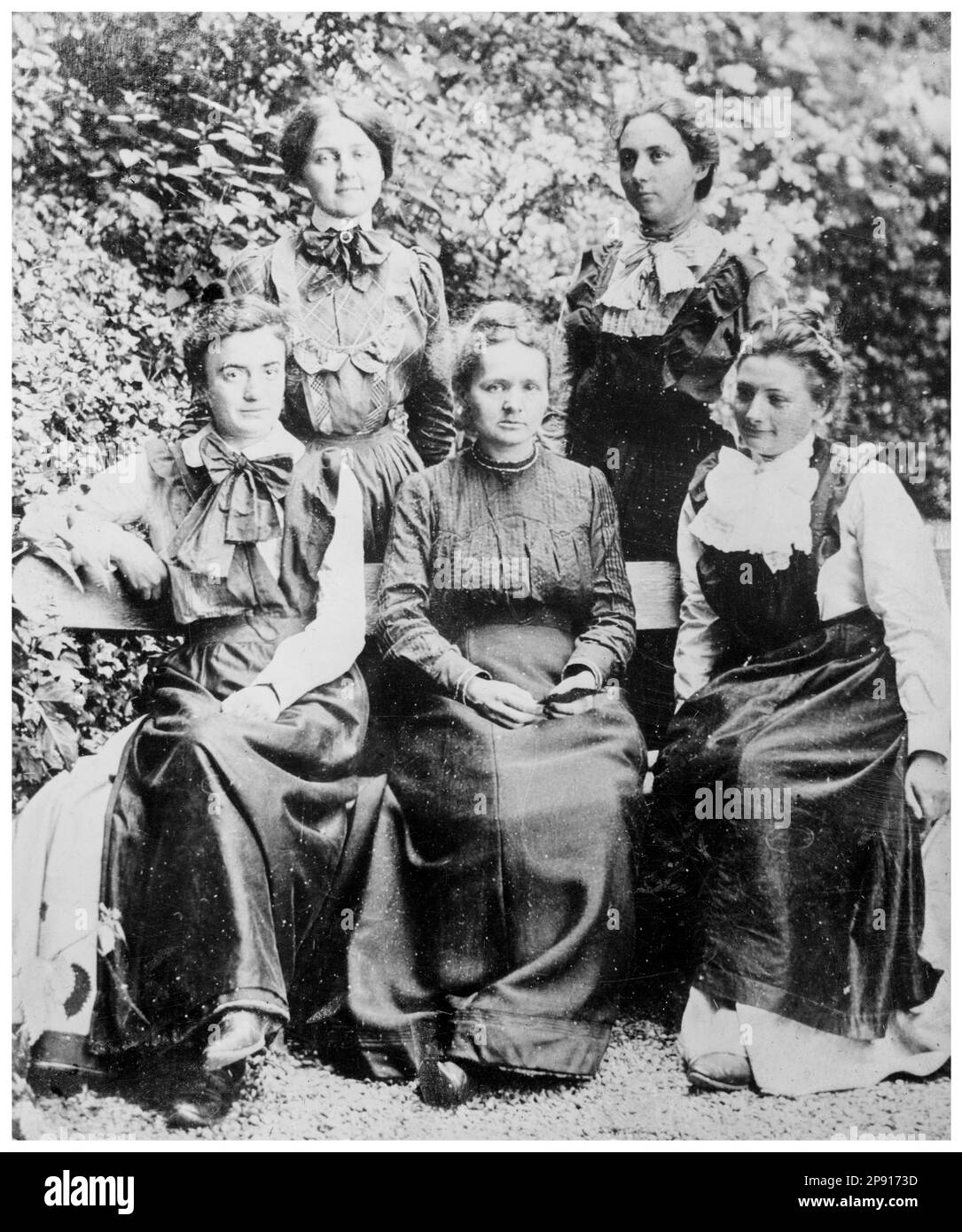 Marie Curie (1867-1934), surrounded by four of her students, portrait photograph by Bain News Service, 1910-1915 Stock Photo