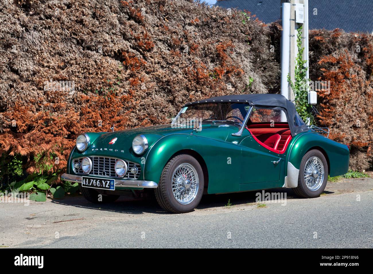 Plougasnou, France - July 17 2021: The Triumph TR3 is a British sports car produced between 1955 and 1962 by the Standard-Triumph Motor Company of Cov Stock Photo