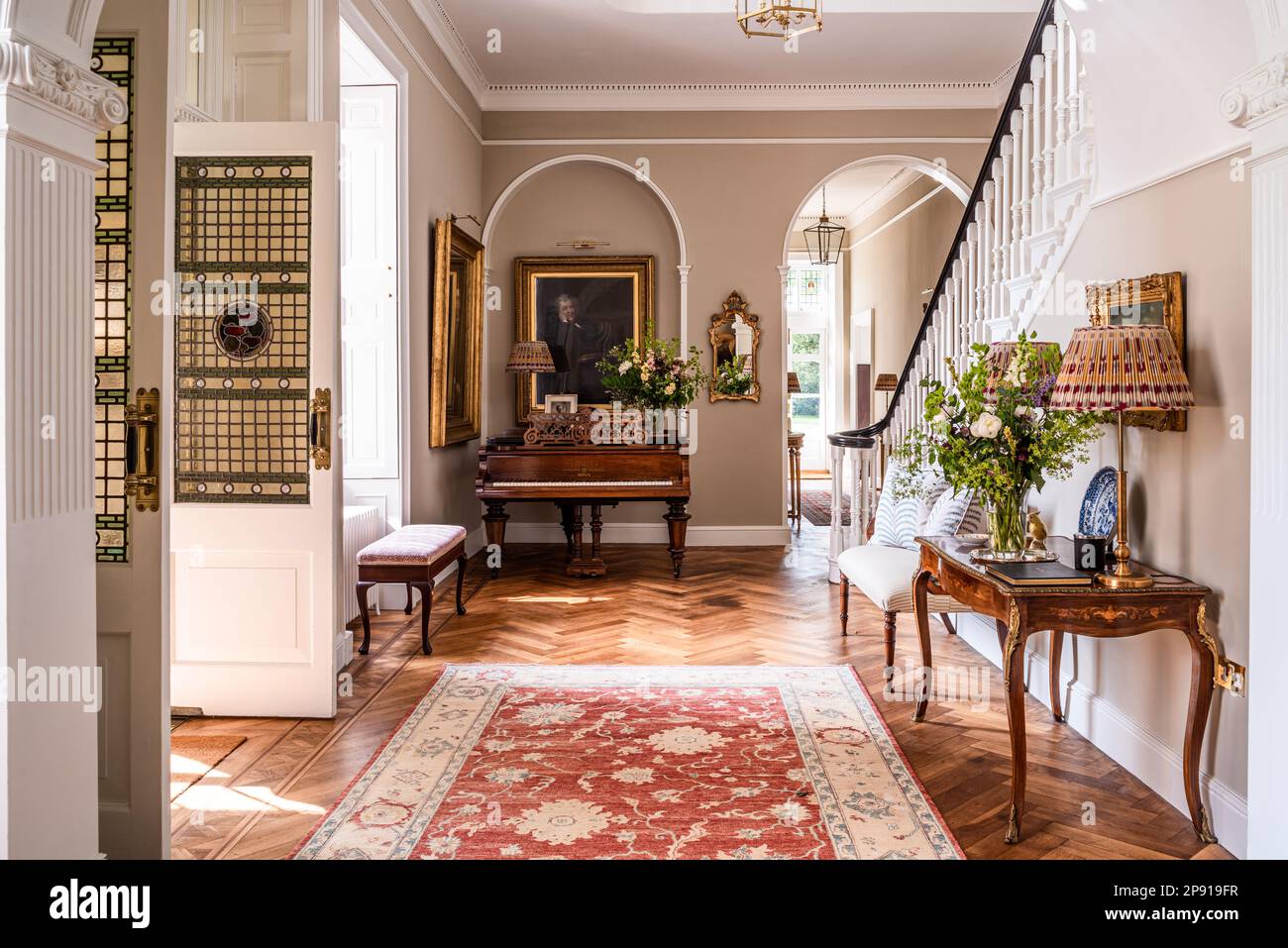 Spacious hallway entrance to renovated 18th century Grade II listed Suffolk country house, UK Stock Photo