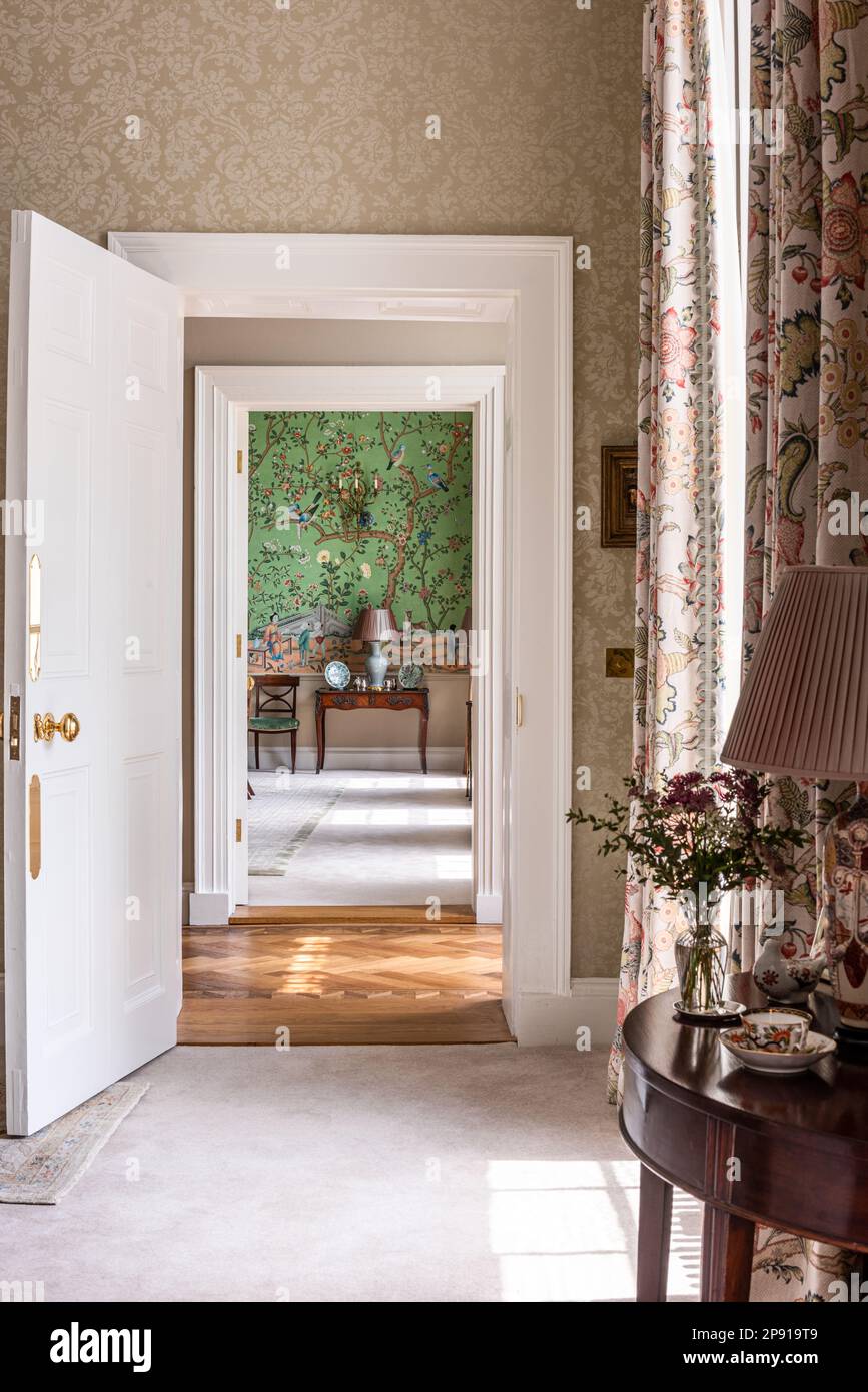 View through doorway of de Gournay wallpaper in 18th century Grade II listed Suffolk country house, UK Stock Photo
