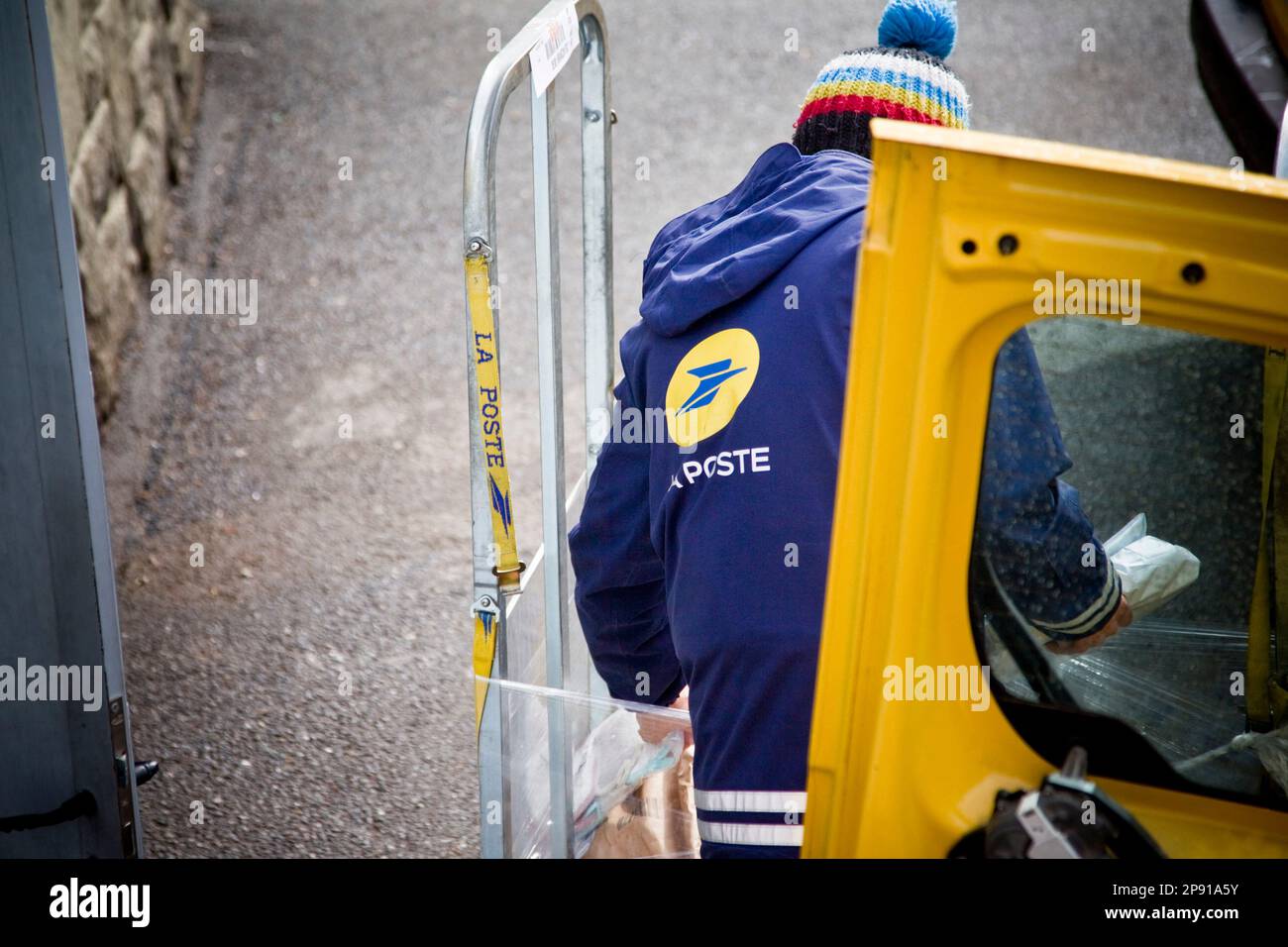 Briancon, France. 09th Mar, 2023. A postman puts the mail and parcels