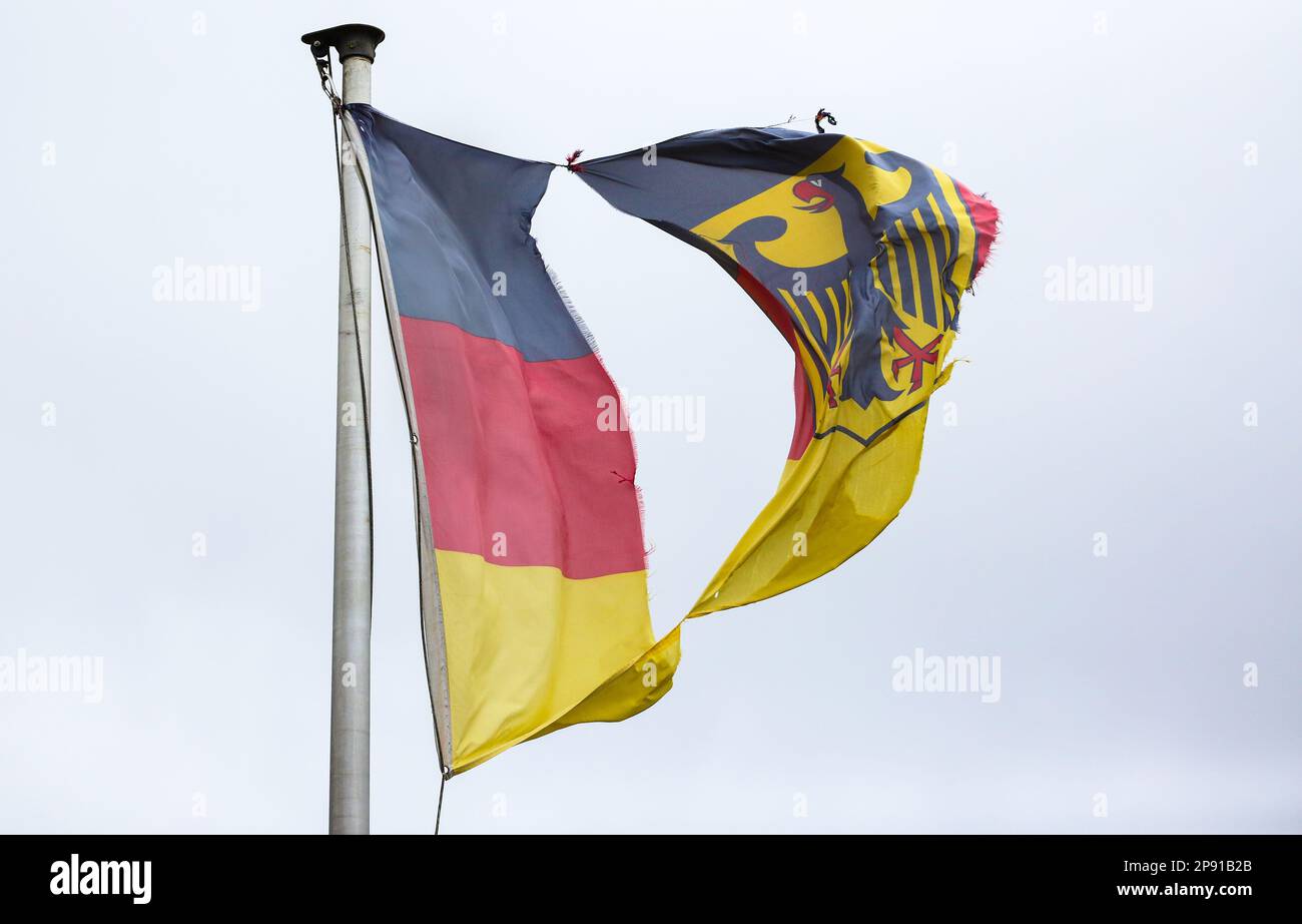 Riedlingen, Germany. 10th Mar, 2023. A German flag torn by the storm flies on a flagpole Credit: Thomas Warnack/dpa/Alamy Live News Stock Photo