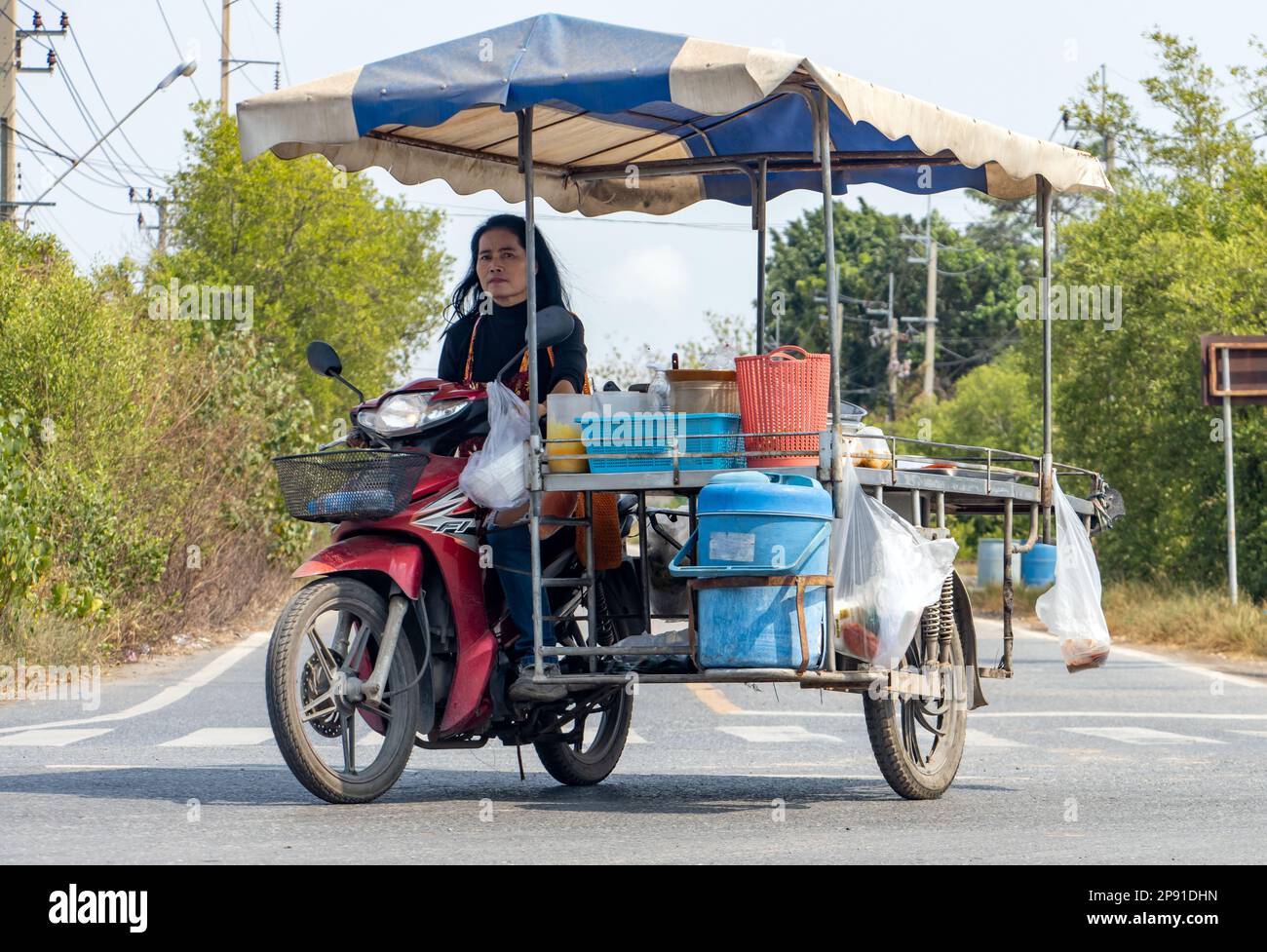 BANGKOK, THAILAND, FEB 07 2023, A Papaya salad seller with a mobile