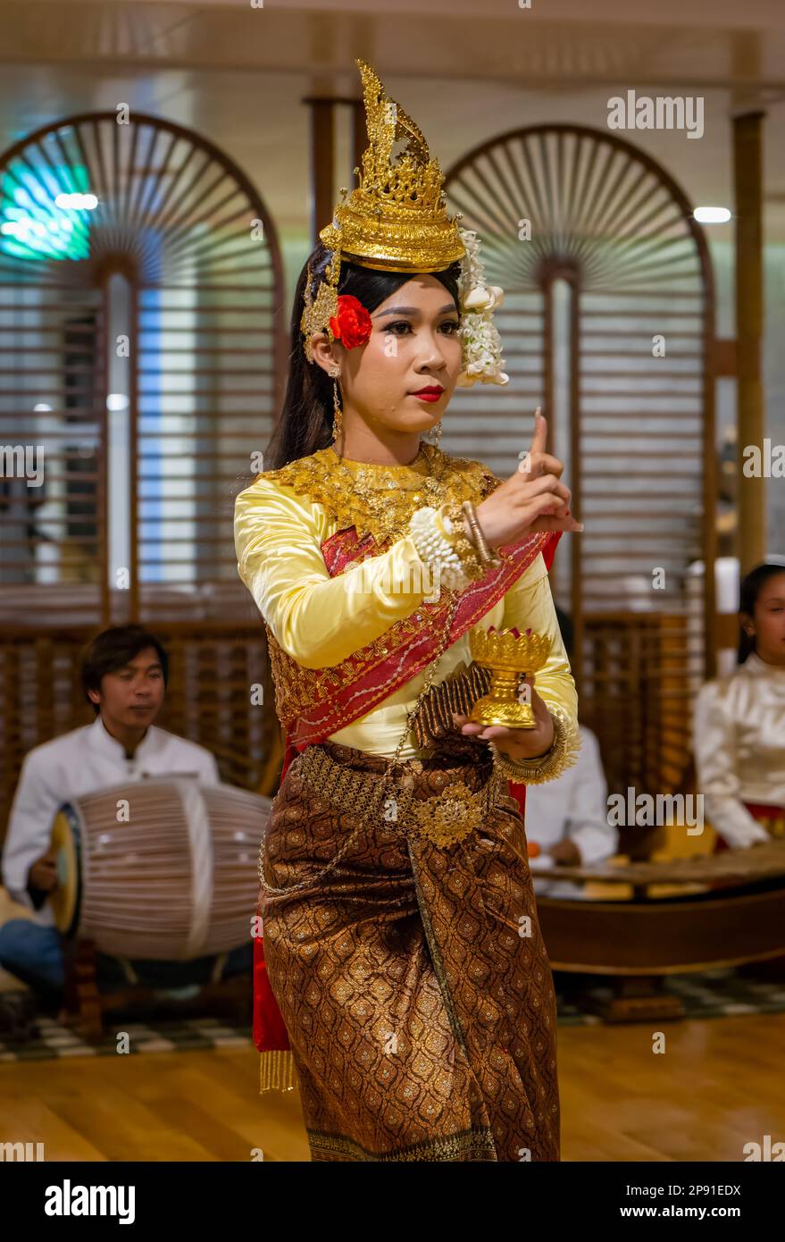 Traditional Khmer dancers in Cambodia perform on a river cruise ship moored in the capital Phnom Penh. Stock Photo
