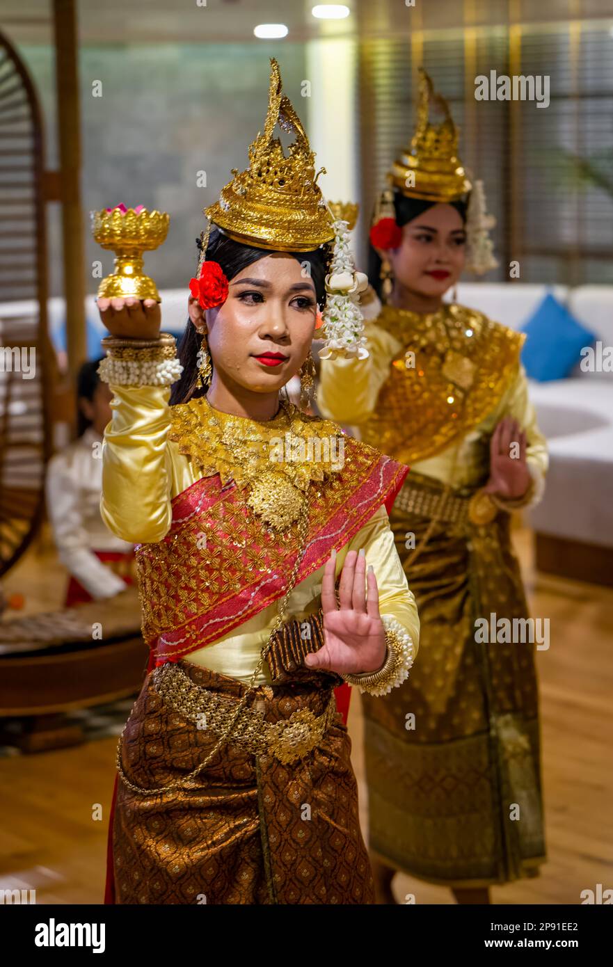 Traditional Khmer dancers in Cambodia perform on a river cruise ship moored in the capital Phnom Penh. Stock Photo