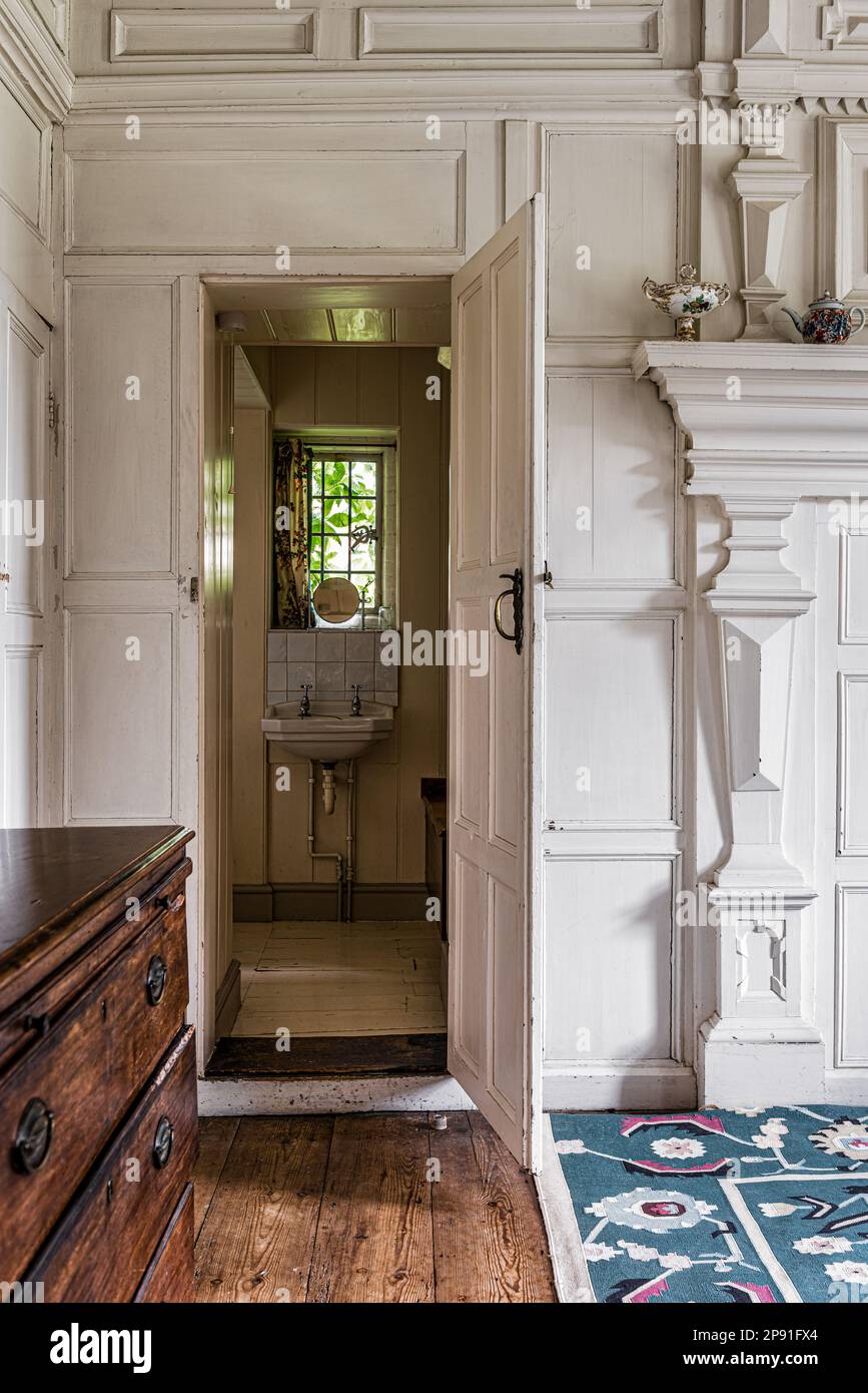 View through open door to en suite bathroom in Wiveton Hall 17th century Jacobean manor house, Norfolk, UK Stock Photo