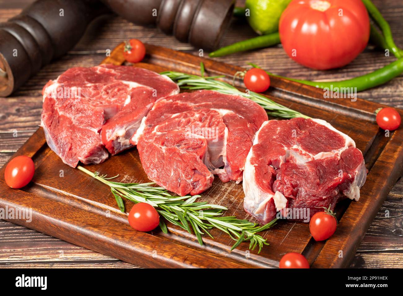 Raw boneless beef shank. Uncooked beef shank meat on a wood serving