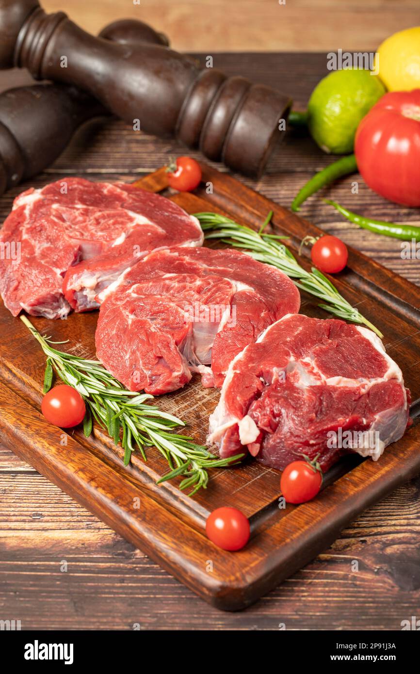 Raw boneless beef shank. Uncooked beef shank meat on a wood serving