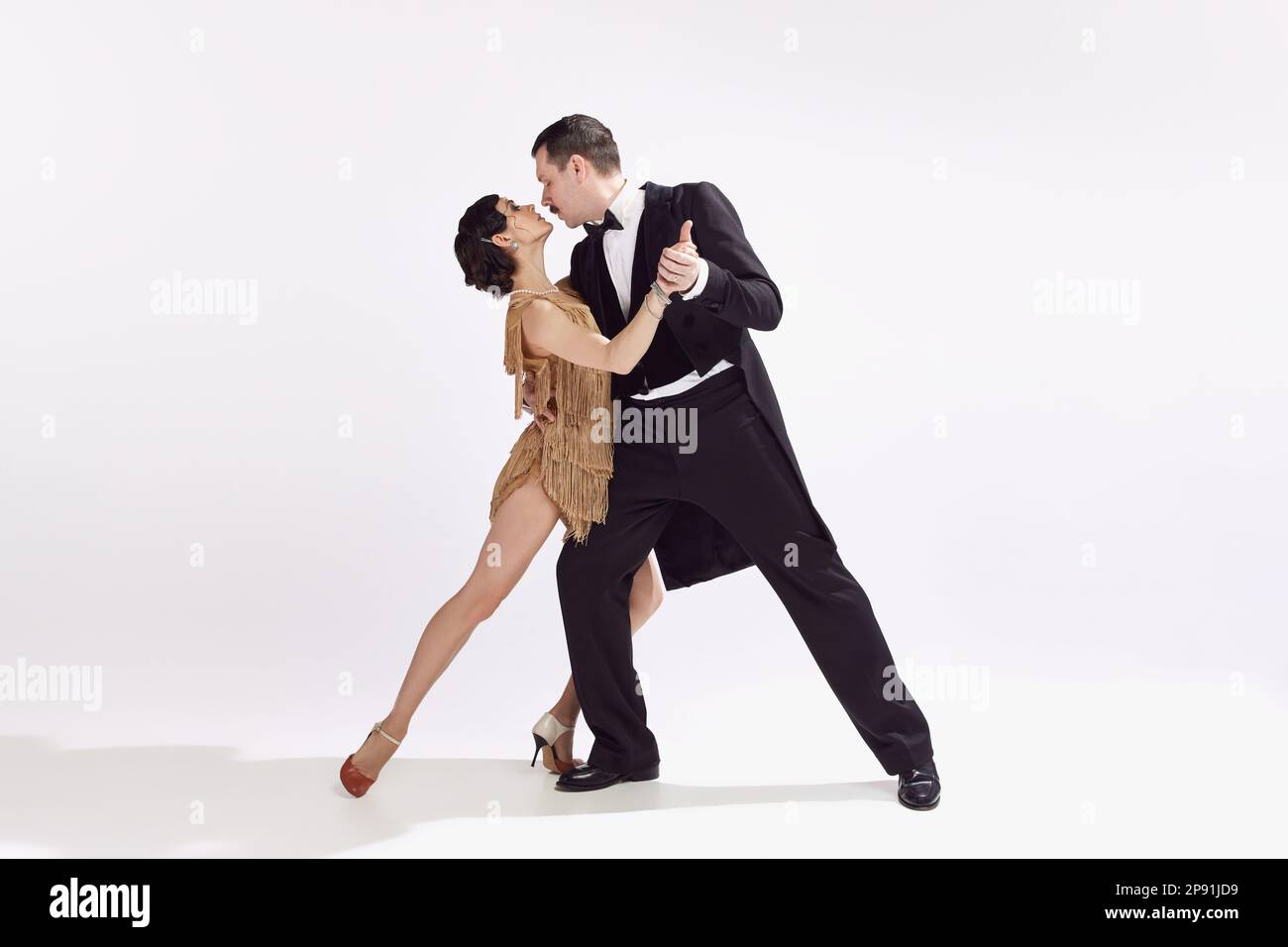 Passion. Elegant couple of dancers in vintage evening dress and suit  dancing retro ballroom dance. Love and music, vintage fashion Stock Photo -  Alamy