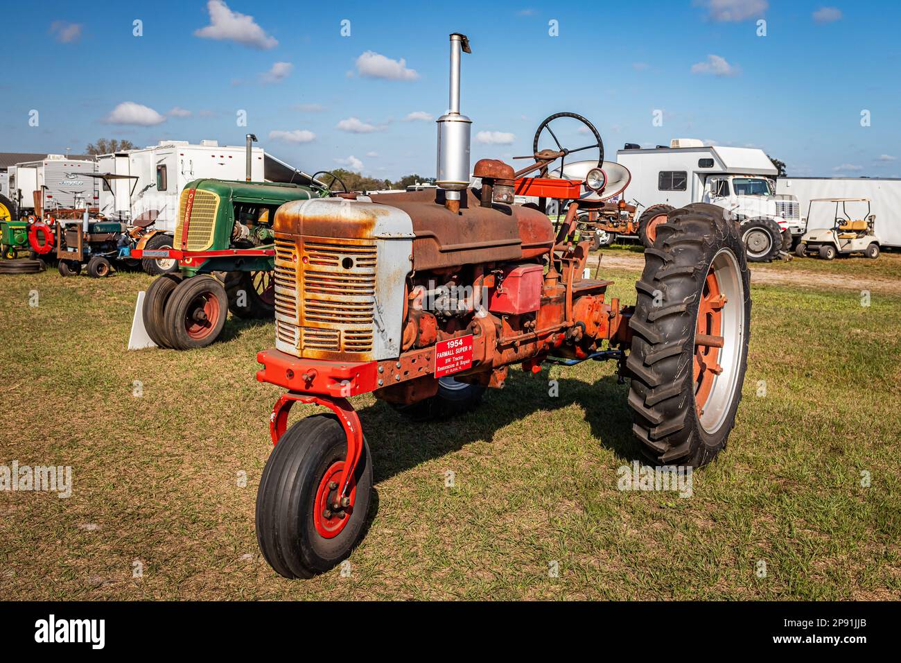 Fort Meade, FL - February 26, 2022: High perspective front corner view of a 1954 International Harvester McCormick Farmall Super H Tractor at a local Stock Photo