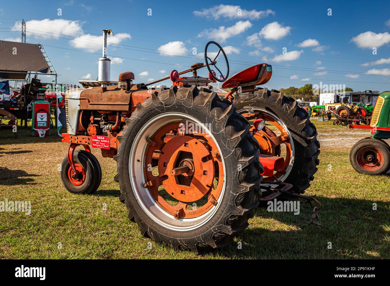 Fort Meade, FL - February 26, 2022: High perspective rear corner view of a 1954 International Harvester McCormick Farmall Super H Tractor at a local t Stock Photo