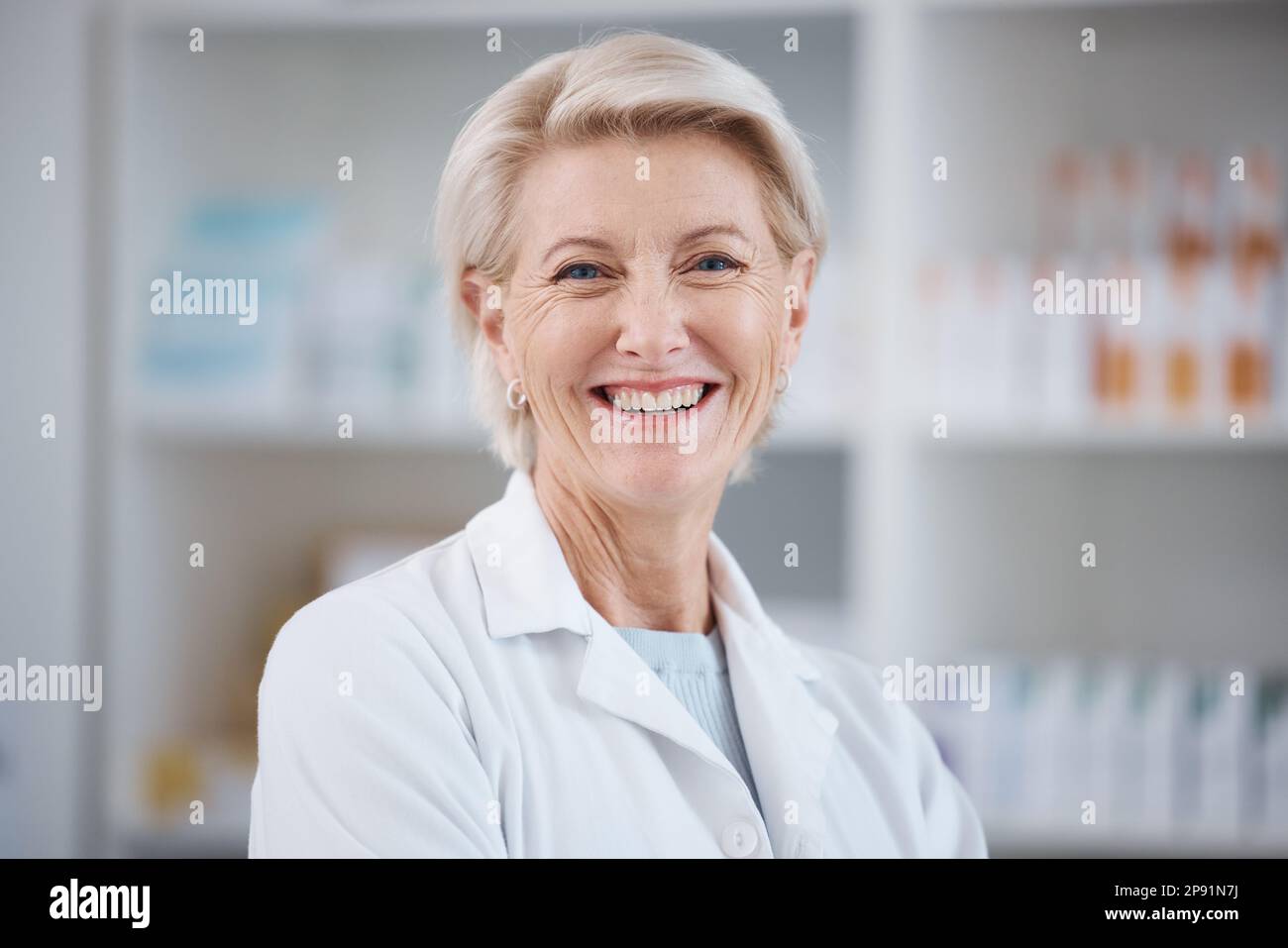 Pharmacy, pharmacist portrait and smile of woman in drugstore or medicine shop. Healthcare, wellness face and happy, proud and confident senior Stock Photo