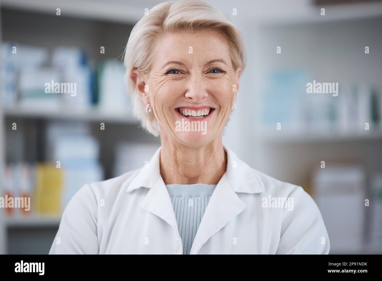 Pharmacy, pharmacist portrait and smile of woman in drugstore or medicine shop. Healthcare, doctor face and happy, proud and confident senior medical Stock Photo