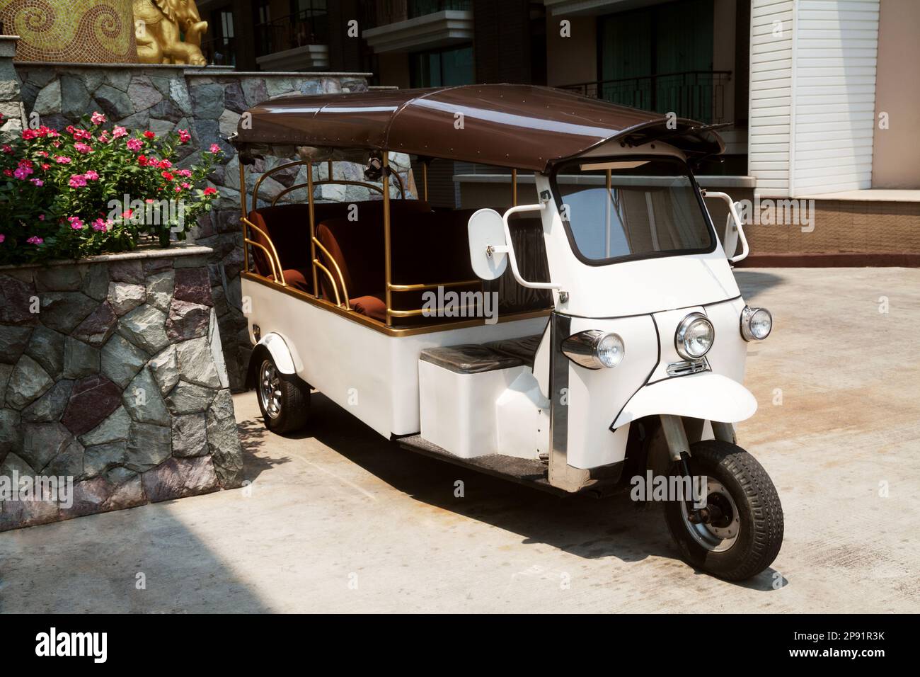 Hotel tuk-tuk taxi car waiting for passenger tourists in Thailand. Thai three wheeled auto rickshaw Stock Photo