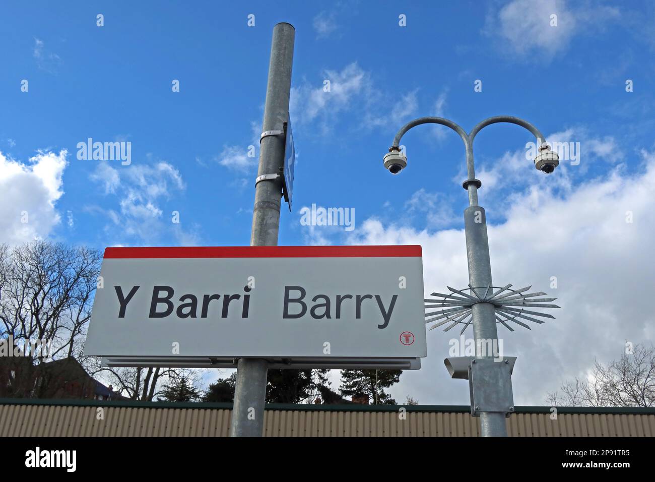 Blue skies at Barry railway station platform sign with CCTV, Broad Street, ( Y Barri), Vale of Glamorgan, South Wales, Cymru, UK Stock Photo