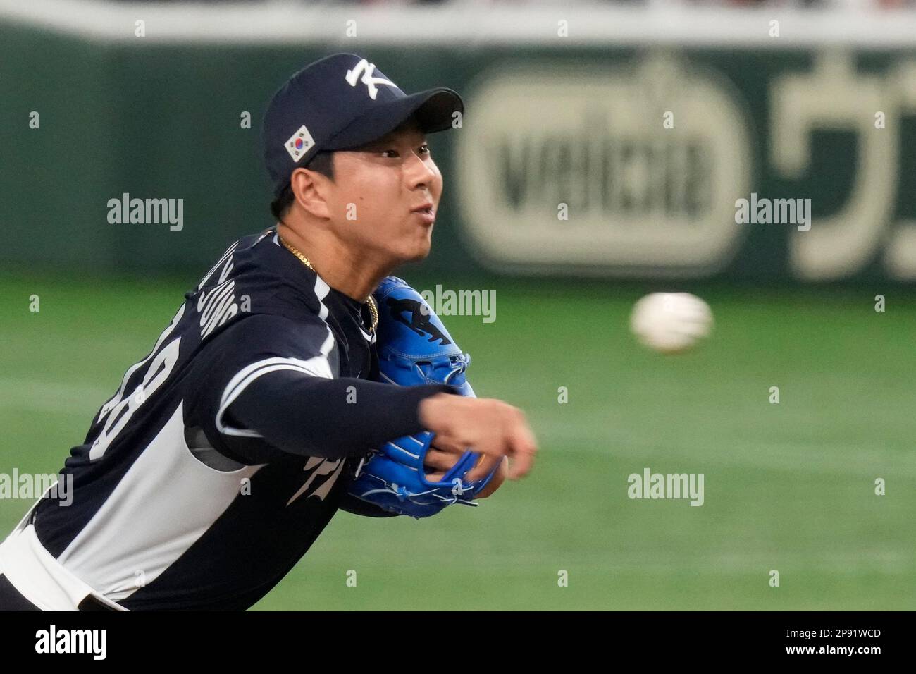 South Korea's pitcher Jung Wooyoung throws during the sixth inning of