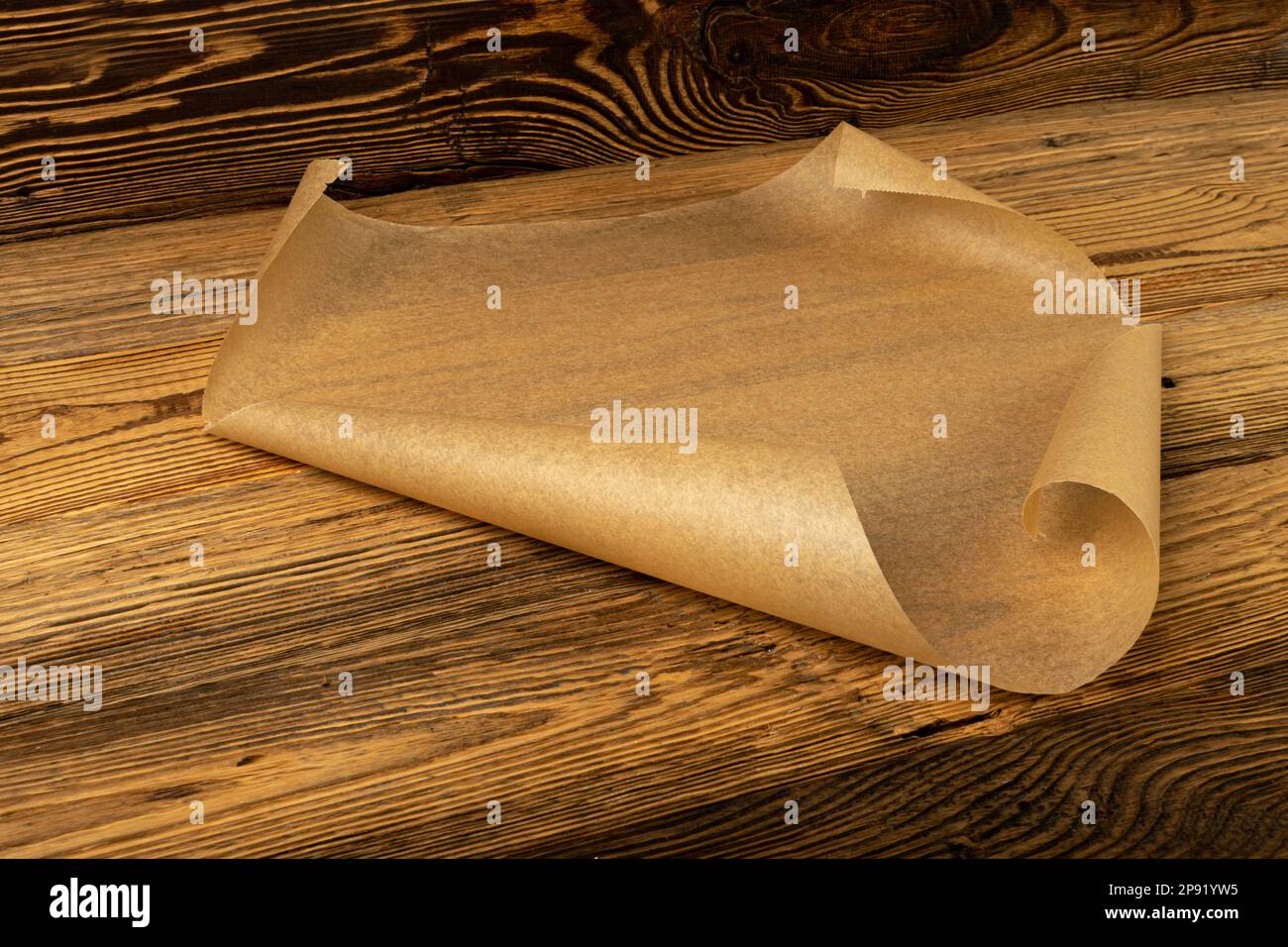 https://c8.alamy.com/comp/2P91YW5/brown-baking-paper-kraft-cooking-paper-sheet-on-wooden-texture-background-bakery-parchment-mockup-greaseproof-baking-paper-2P91YW5.jpg