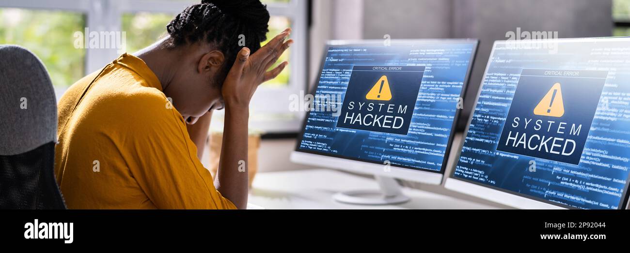 Computer System Hacked. Virus Software Screen On Monitor Stock Photo