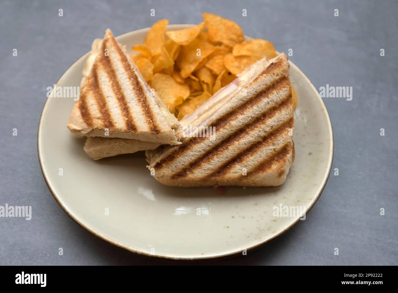Ham and cheese toast served with chips, Bavaria, Germany Stock Photo