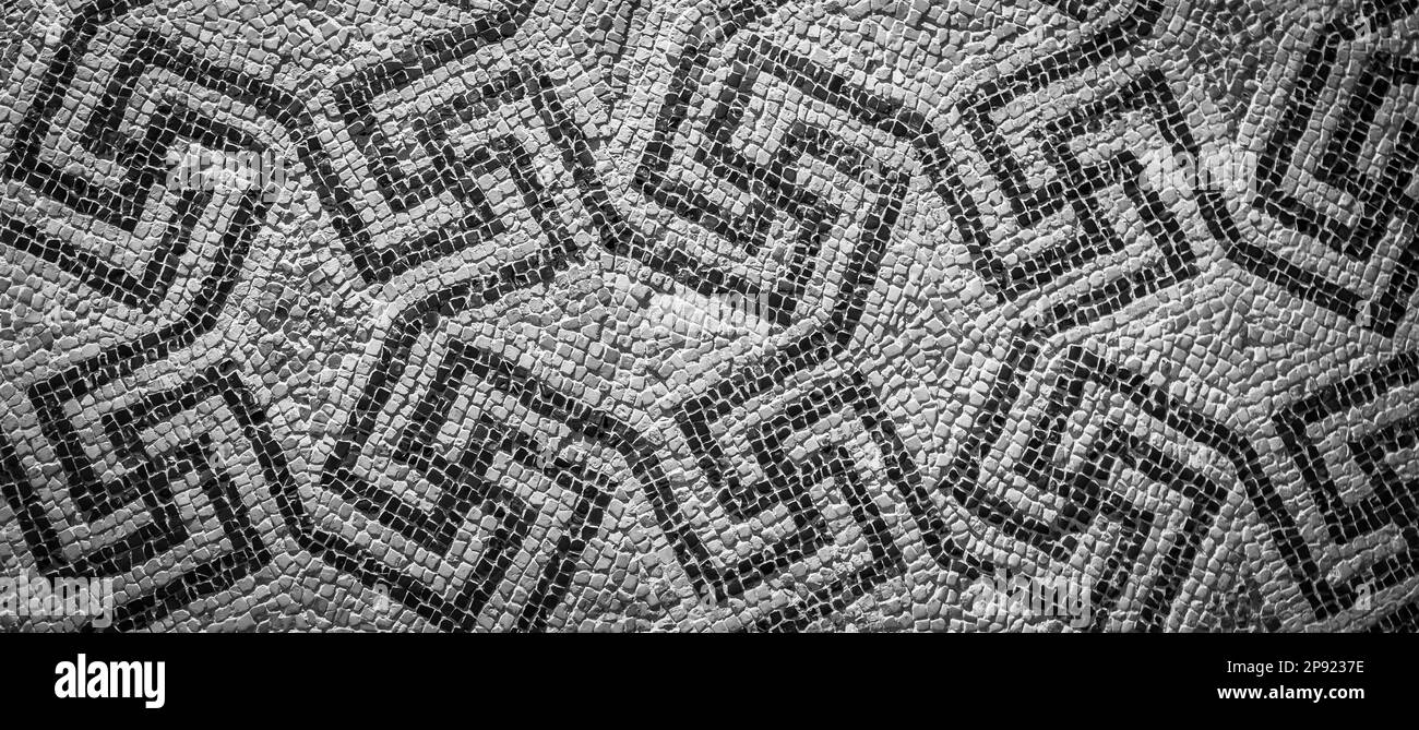 Swastika symbol in ancient Celtic mosaic decoration. Design for an old style background Stock Photo