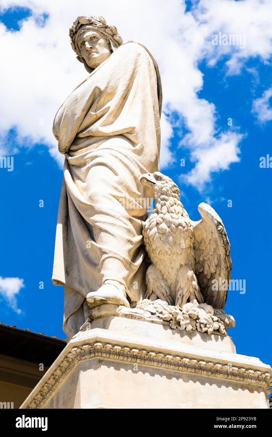Dante Alighieri statue in Florence, Tuscany region, Italy, with an amazing blue sky background Stock Photo