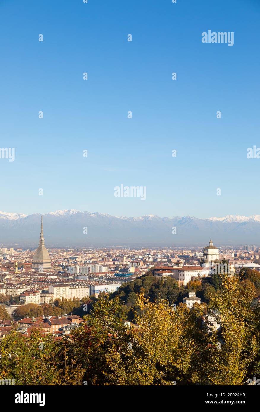 Turin, Italy - Circa November 2021: panorama with Alps and Mole Antonelliana, . Skyline of the symbol of Piedmont Region withi Monte dei Cappuccini - Stock Photo