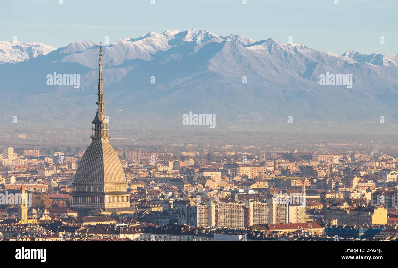 Turin, Italy - Circa November 2021: panorama with Alps and Mole Antonelliana, . Skyline of the symbol of Piedmont Region from Monte dei Cappuccini - Stock Photo