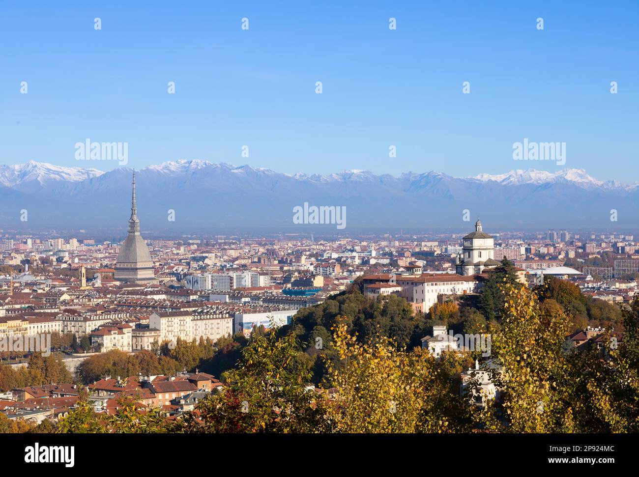 Turin, Italy - Circa November 2021: panorama with Alps and Mole Antonelliana, . Skyline of the symbol of Piedmont Region withi Monte dei Cappuccini - Stock Photo