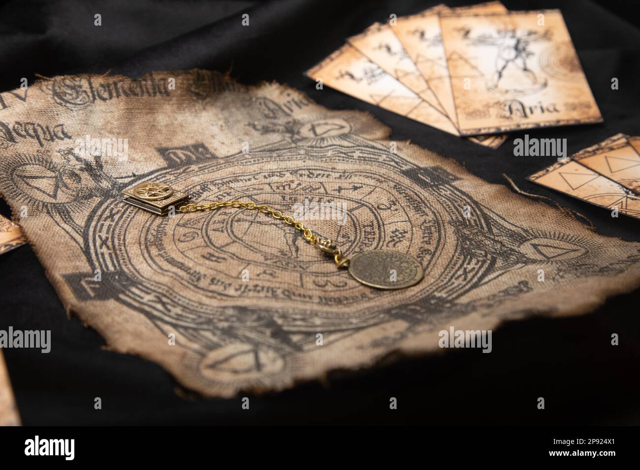 Ancient esoteric witchcraft background. Occultims and paganism old symbol, with mysterious runes and alphabet Stock Photo