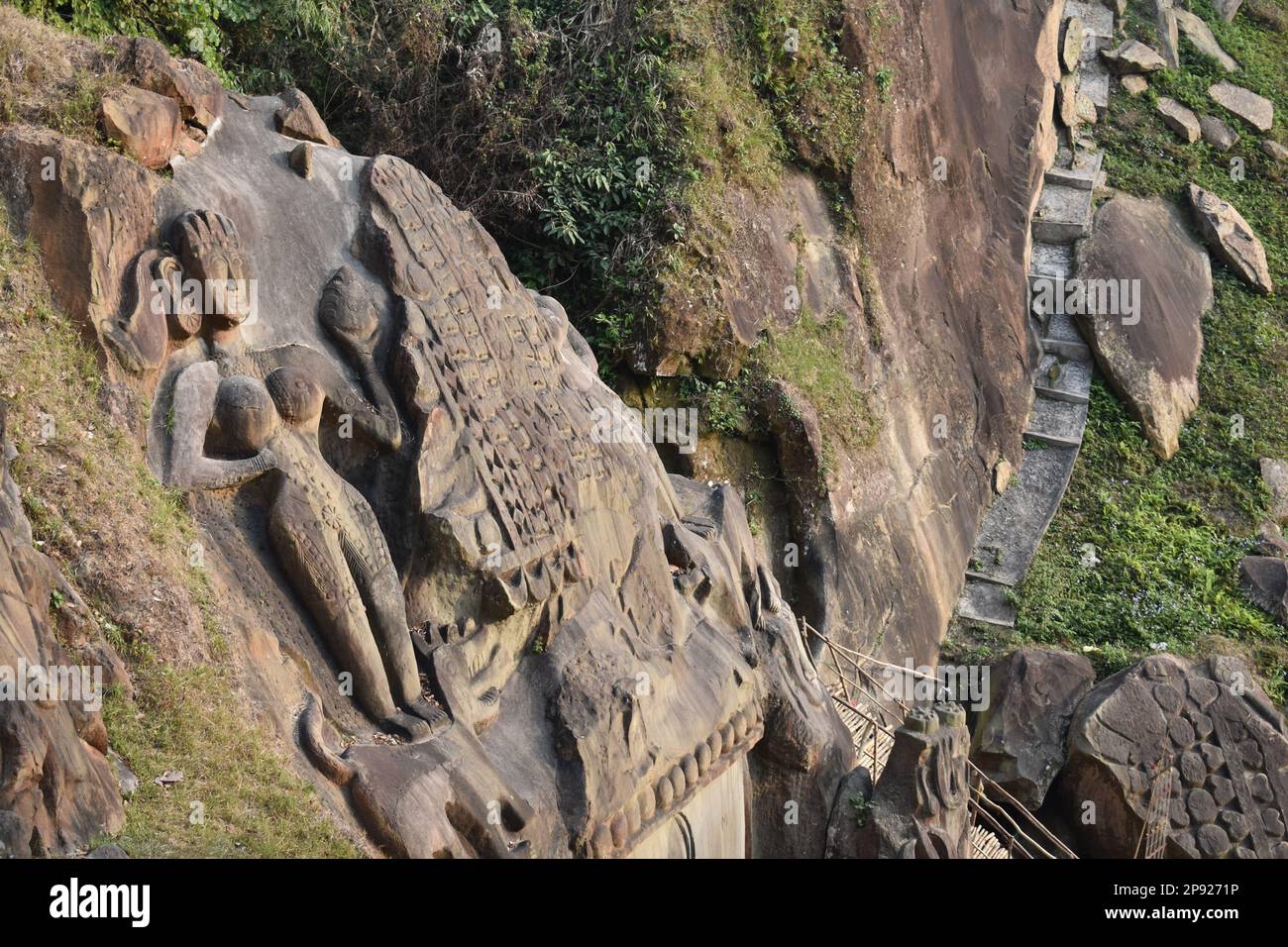 an old female goddess carving on a mountain in Unokoti, Tripura, India. Stock Photo