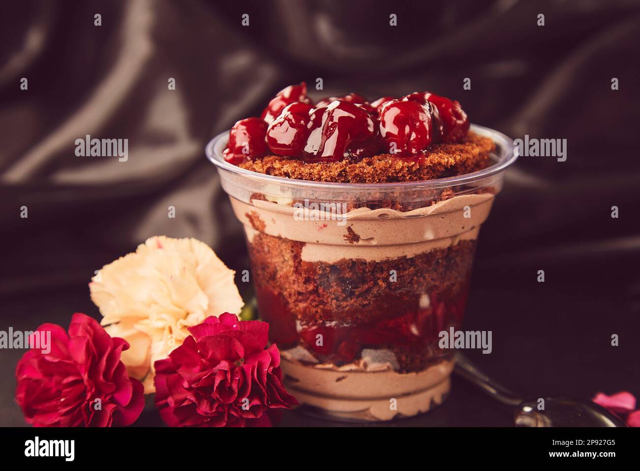 Natural aesthetic sugar free, vegan, healthy layered dessert with fresh cherry. Catering, desserts in portions. Stock Photo