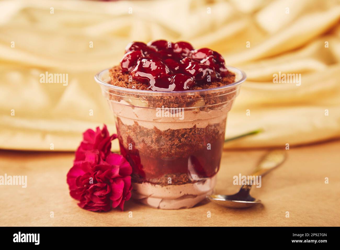 Dreamy Escapism Dessert - Natural sugar free, vegan, healthy layered dessert with fresh cherry. Stock Photo